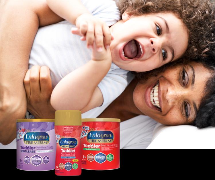Laughing mom and toddler with a lineup of toddler nutritional drinks